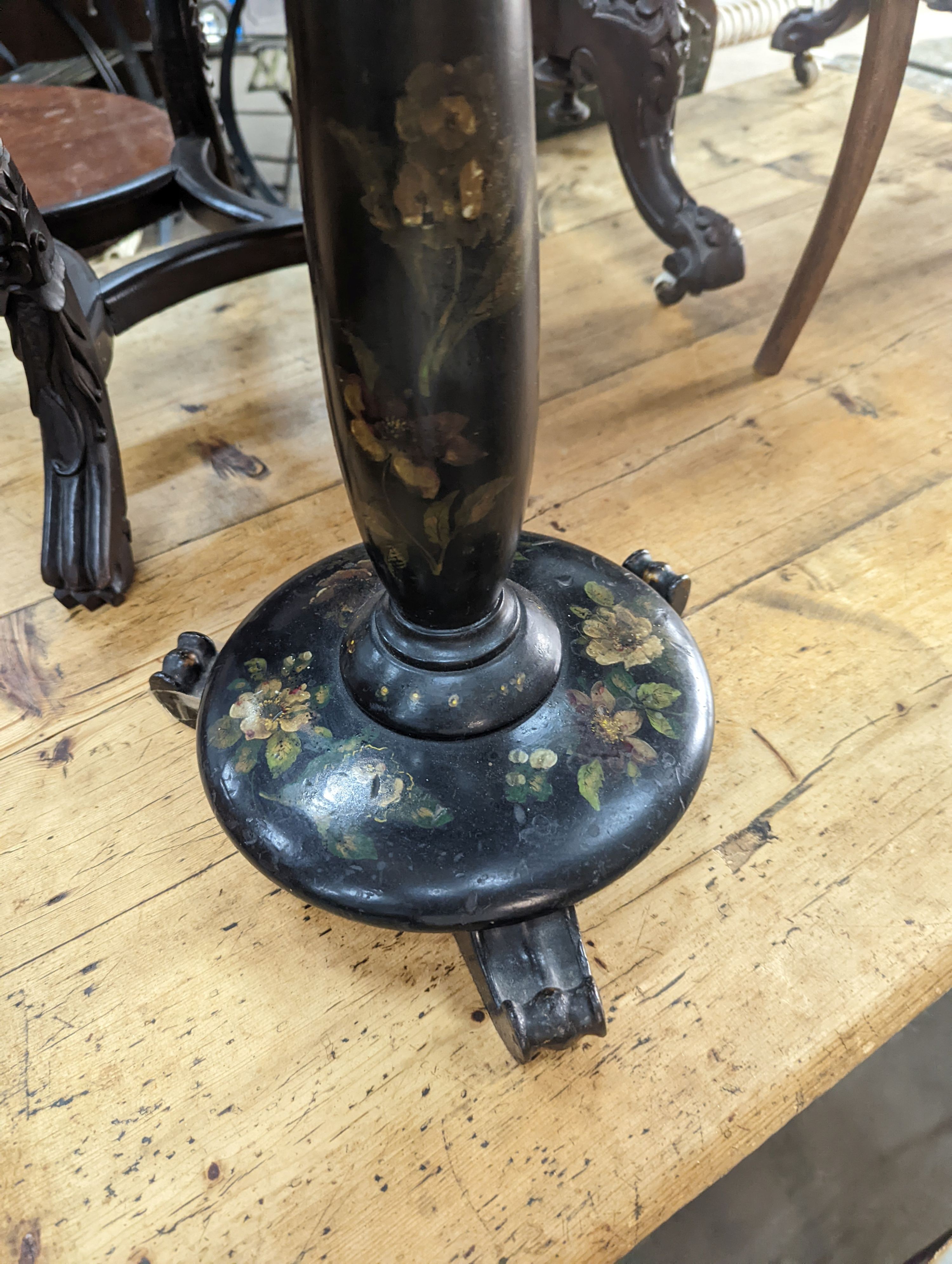 A Victorian floral painted papier mache occasional table, with a shaped oval top (converted from a pole screen), width 40cm, depth 33cm, height 53cm